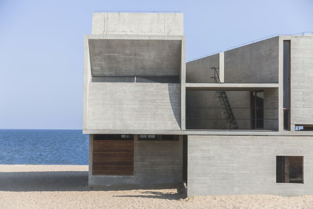 Contemporary beach house with concrete and wood facade